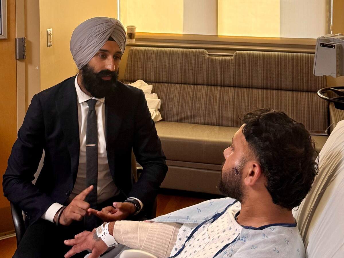 Jasjit Singh, Jakara Movement director of legal services, talks with a Sacramento truck driver, Gurvinder Singh who was attacked in Wyoming on Sunday, Sept. 13, 2026.